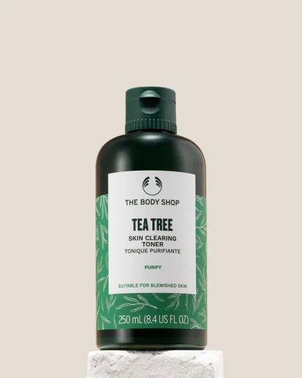 The Body Shop Tea Tree Skin Clearing Toner 250ml displayed on a clean pedestal against a soft background