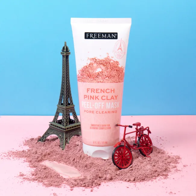 Freeman French Pink Clay peel-off mask tube with pink clay powder on surface