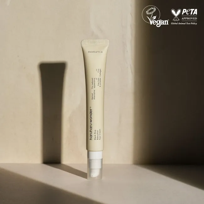 A tube of BLACK RICE bakuchiol eye cream for reduced appearance of fine lines and wrinkles for sensitive skin with Vegan and Peta approval logos