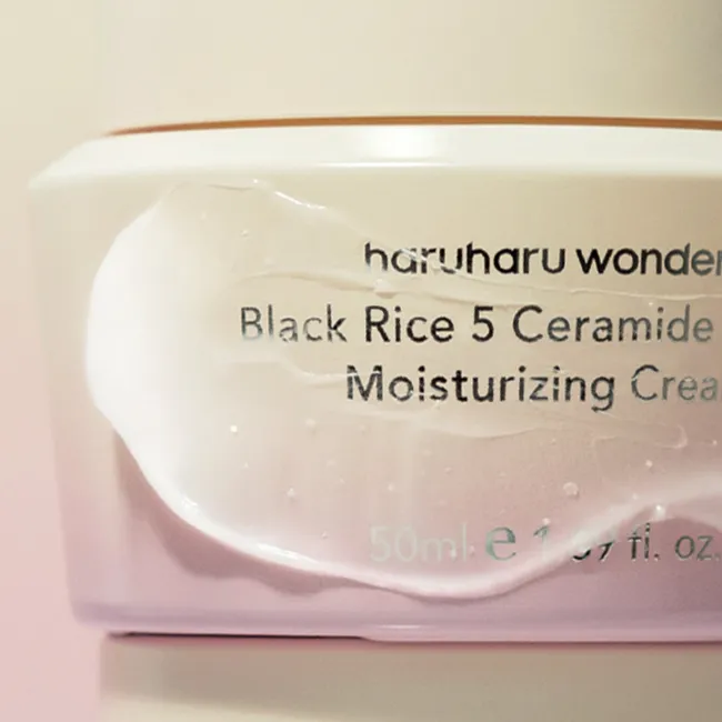 A jar of haruharu wonder Black Rice 5 Ceramide Barrier Moisturizing Cream, with a capacity of 50ml, in white and purple jar with ceramide capsules on it.