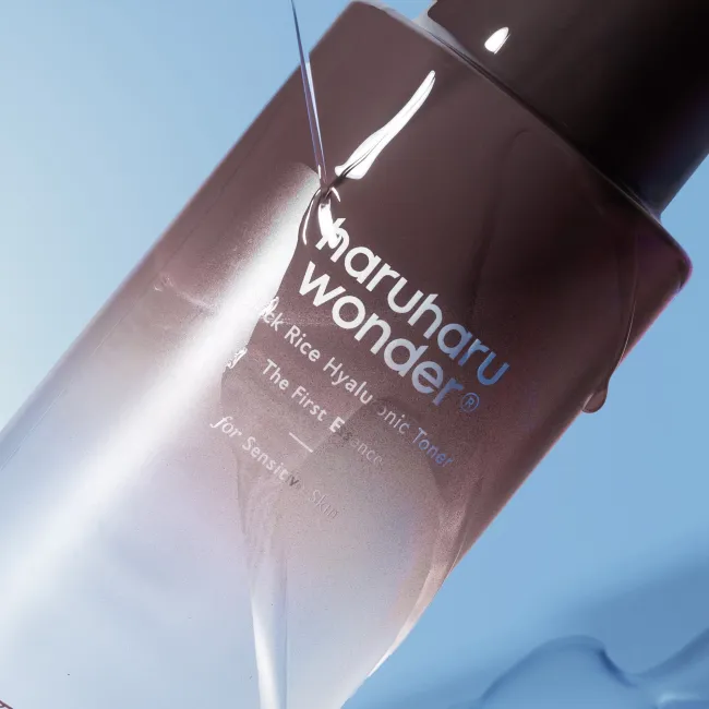 haruharu wonder Black Rice  Hyaluronic Toner Free of Alcohol & Fragrance bottle on a blue background