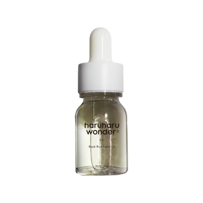 10ml of haruharu wonder black rice facial oil bottle with dropper on a white background