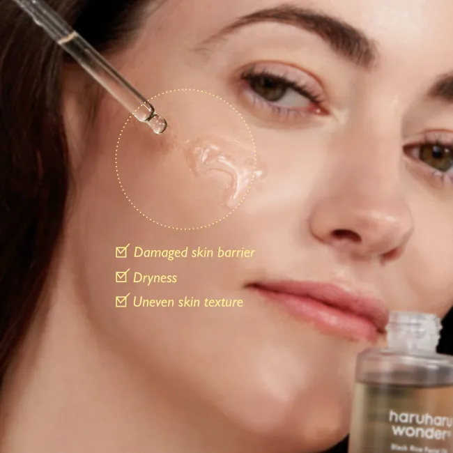Close-up of a woman's face with text indicating skin issues and a dropper bottle of haruharu wonder black rice facial oil