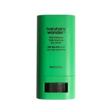 A green haruharu wonder black bamboo daily soothing sun shield sun stick SPF 50+ PA++++ with very high protection and 20g weight on a white background.