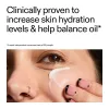 Close-up of a person applying Omega water cream to their face with text about skin hydration and oil balance.