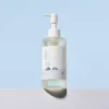 Clear bottle with pump dispenser, minimalist label, Korean text, pale blue background