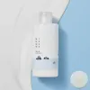 Clean skincare bottle with minimalist design, featuring Korean text and mountain illustration on a blue background.