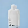 White skincare bottle with 1025 label and cute seal design on blue background
