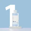 Round Lab 1025 Dokdo Toner bottle with minimalist design on a light blue background