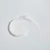 Smooth white cream texture on a clean background, ideal for clean skincare routines.