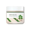 Korean skincare cream with centella asiatica, featuring calming green leaf design and farm illustration for soothing skin care.