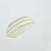 Smooth, creamy skincare cream swatch with lightweight texture on white background, ideal for hydration and gentle care.