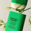 A green haruharu wonder black bamboo daily soothing sun shield sun stick SPF 50+ PA++++ with very high protection and 20g weight on a white background.