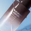 haruharu wonder Black Rice  Hyaluronic Toner Free of Alcohol & Fragrance bottle on a blue background